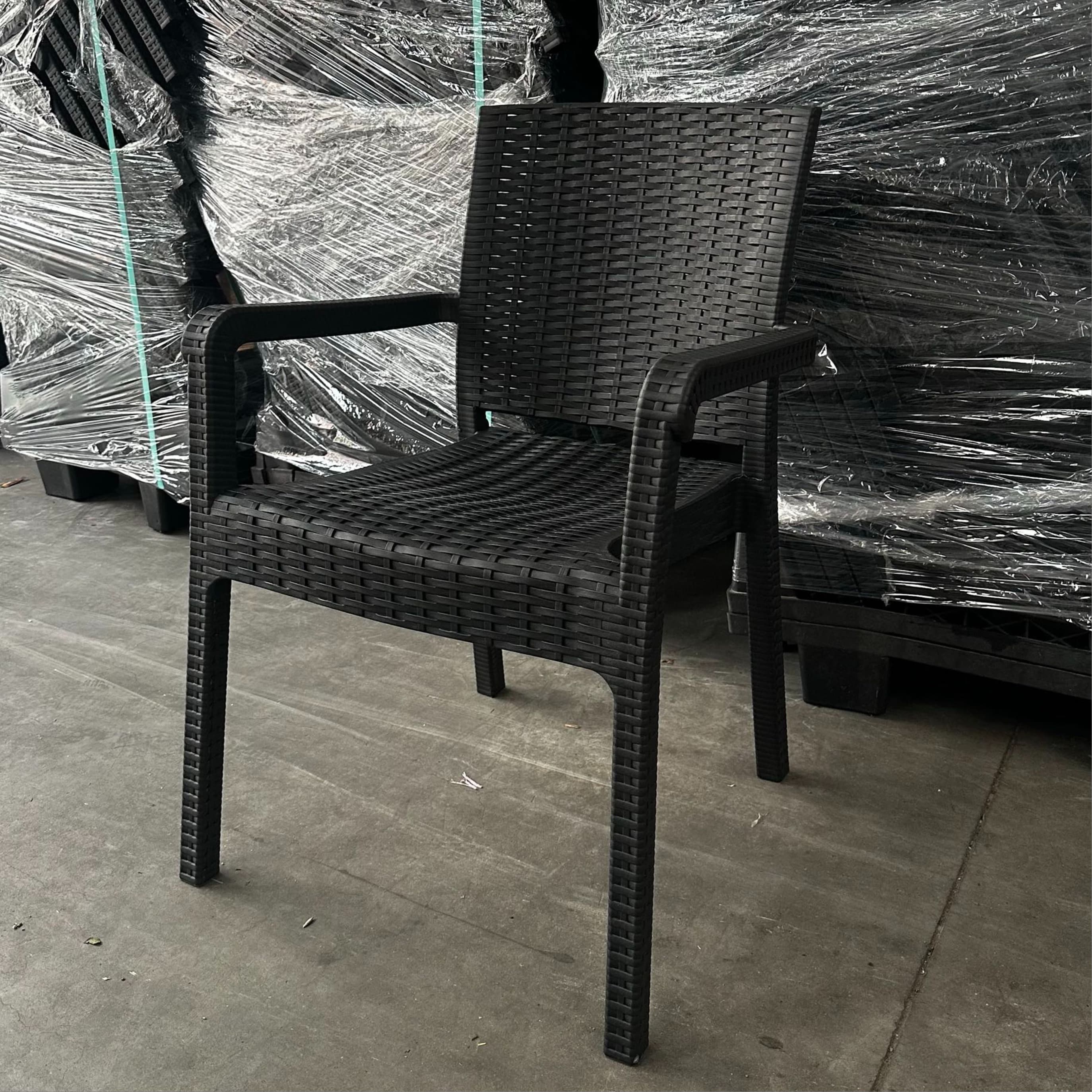 ALEZZO | Stackable outdoor terrace chair in woven‑look plastic – with armrests